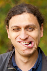 man making grimace face, Troll face.