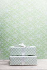 Gift box on a vintage wallpaper