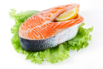 Salmon steak with lemon isolated on white
