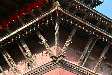 Fototapeta na wymiar Carved wooden tunala columns on a pagoda