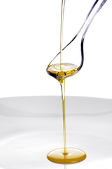 Olive Oil poured onto a spoon