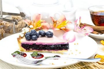 piece of blueberry pie on a table in a restaurant