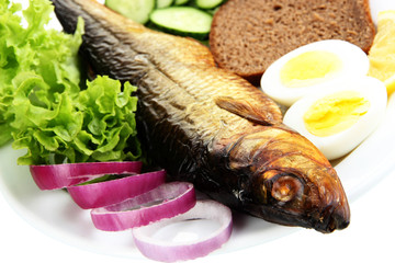 Smoked fish on plate close up