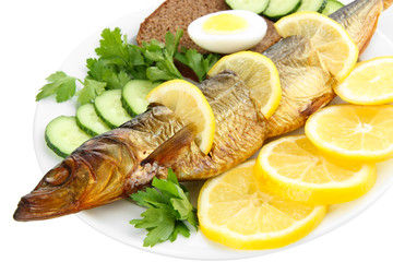 Smoked fish on plate isolated on white