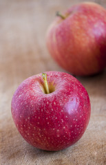 red apples on wooden table, selective focus