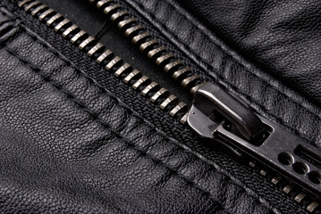 Close-up zipper on black leather jacket © Dmitry Erashov