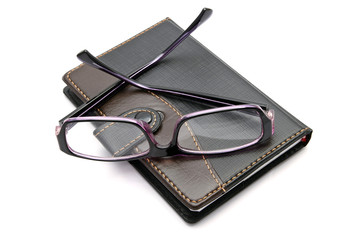 notebook and glasses