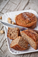 sliced fresh buns, old knife and hazelnuts