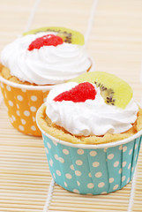 cup cake with strawberry and kiwi fruit on top