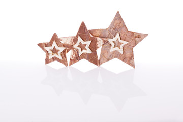 wooden stars christmas decoration on white background