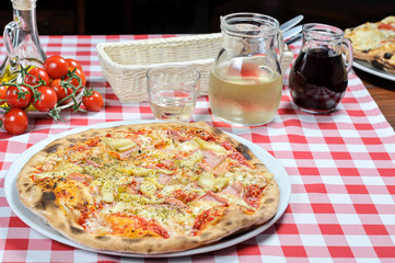 Pizza with ham, olives and other additives