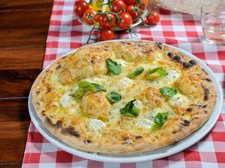 Pizza with ham, olives and other additives