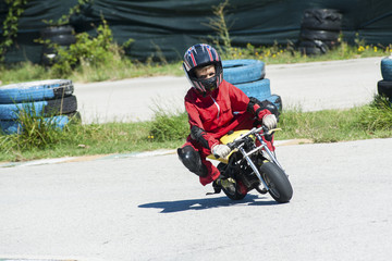 Obraz premium Young driver on minibike