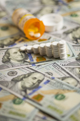 Medicine Pills Stacked on Newly Designed One Hundred Dollar Bill