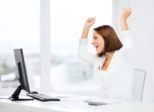 Businesswoman With Computer In Office