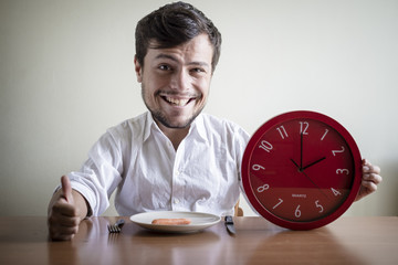 funny puppets man with white shirt holding red clock
