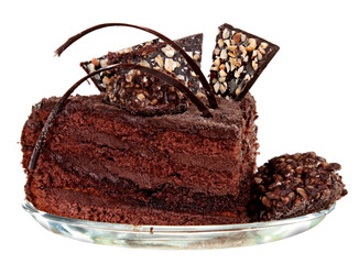 Piece of chocolate cake with icing on white isolated background