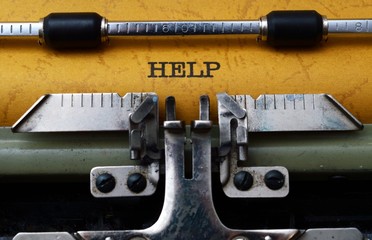 Fototapeta premium Help text on typewriter