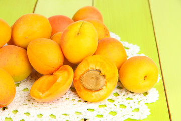 Fresh natural apricot on green wooden table