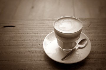 hot coffee on grunge wood background