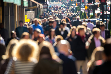Anonymous crowd walking on a street in New York