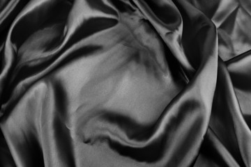 Fototapeta premium Black satin silk fabric texture