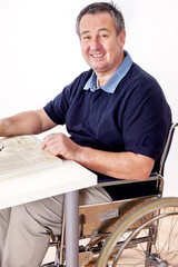 Man sitting in a wheelchair at the table
