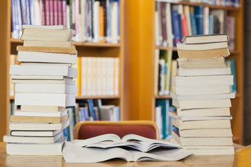 Stacks of books on desk