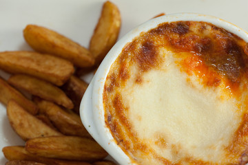 Close up of lasagna and potatoes