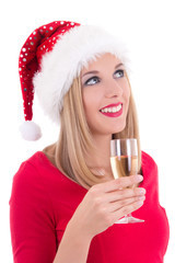 beautiful young woman in santa hat dreaming with glass of champa