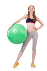 Woman exercising with swiss ball on white