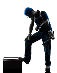 injured manual worker man with injury brace despair silhouette