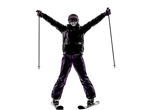 one woman skier skiing arms outstretched happy silhouette