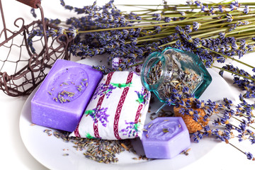 Lavender flowers with soap and glass