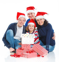 Family in Santa's hat with gift box