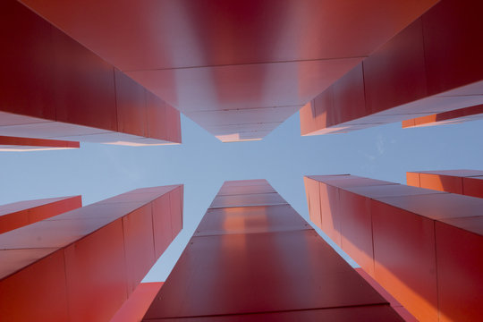 Modern orange obelisque from the bottom