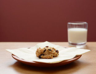 Oatmeal raisin cookie with a glass of milk