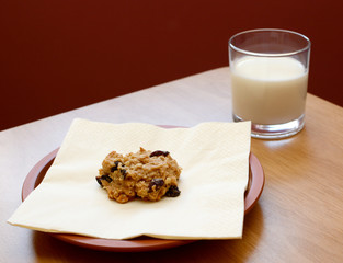 Fresh cookie served with a glass of milk