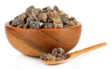 Caramelized sugar in bowl isolated on white