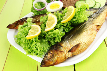Smoked fish on plate close up