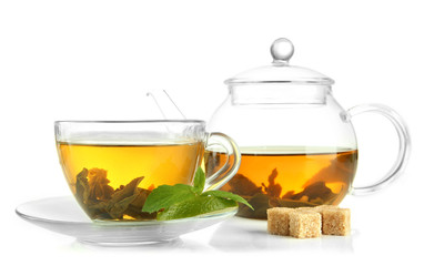 Cup and teapot of green tea with mint and sugar isolated