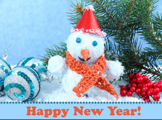 Beautiful snowman and Christmas decor, on blue background