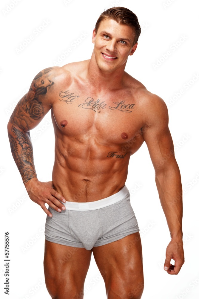 Wall mural man with beautiful muscular tattooed torso in underwear