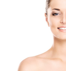 Naklejka premium Close-up portrait of a beautiful woman in makeup on white