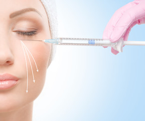 Beautiful face with syringe injection