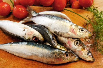 sardines on a wooden cutting board