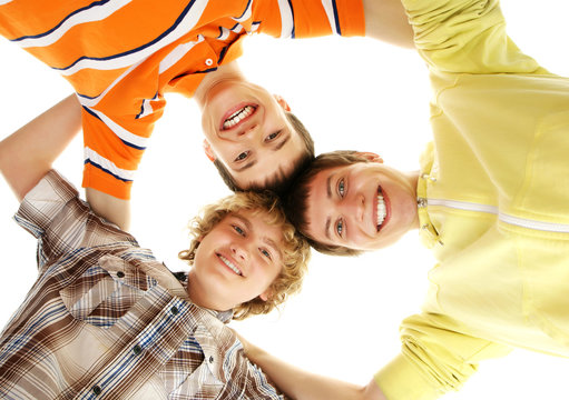 A group of happy teenagers isolated on a white background