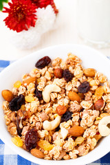 Healthy muesli breakfast with huts and raisin