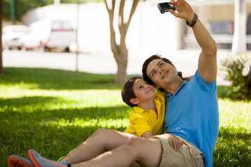 Obraz premium Taking a photo of me and my son