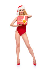 A sexy Santa girl in a Christmas swimsuit isolated on white